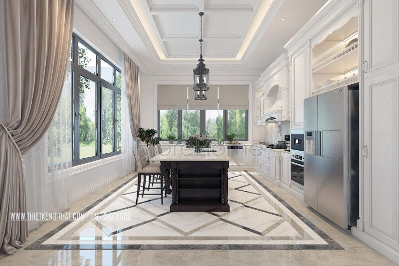 Nội thất phòng bếp gỗ tự nhiên được bố trí hợp lí, bộ tủ bếp hoàng gia kết hợp chiếc bàn đảo chính giữa, tích hợp của nhiều công năng như: bàn ăn phụ, quầy bar... tạo sự thuận tiện cho chủ nhân biệt thự Thiết kế nhà bếp tiện nghi